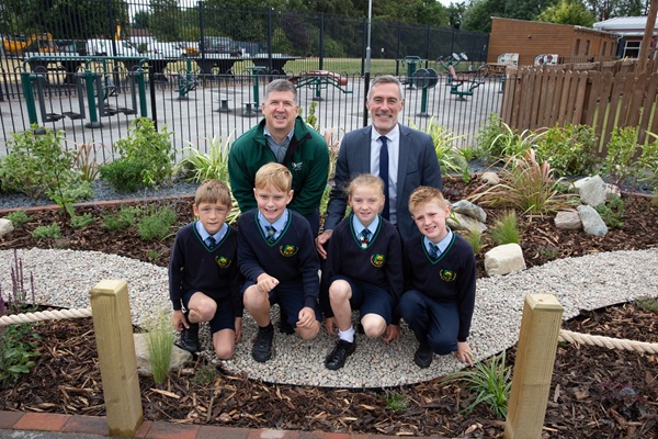 School children posing on sustainable drainage