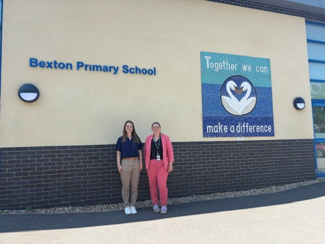 United Utilities employees posed outside school