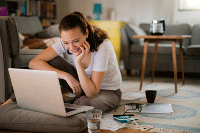Woman looking at laptop